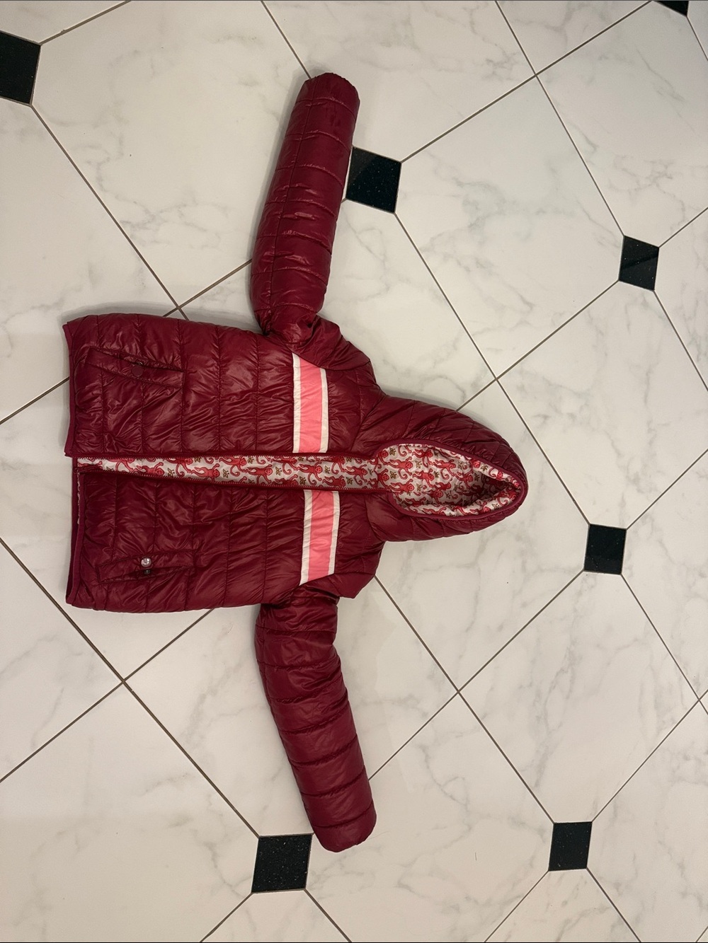 Roller Rabbit Reversible Burgundy Puffer Jacket with Pink Stripe at chest.